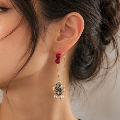 red beaded silver spider dangle earrings