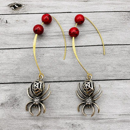 red beaded silver spider dangle earrings