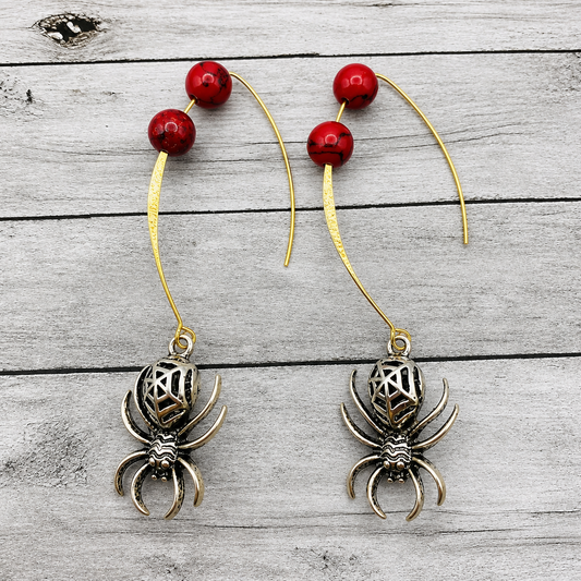 red beaded silver spider dangle earrings