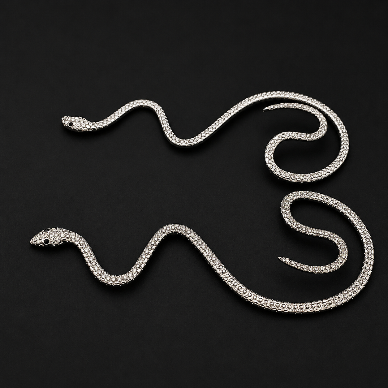 A silver snake-shaped ear cuff