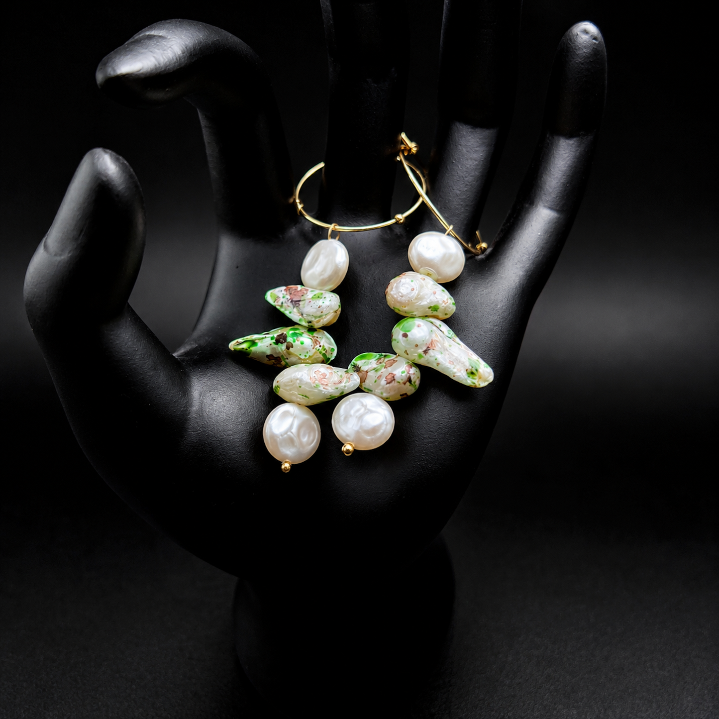 Gold hoop earrings with irregular white baroque pearls and green marbled accents