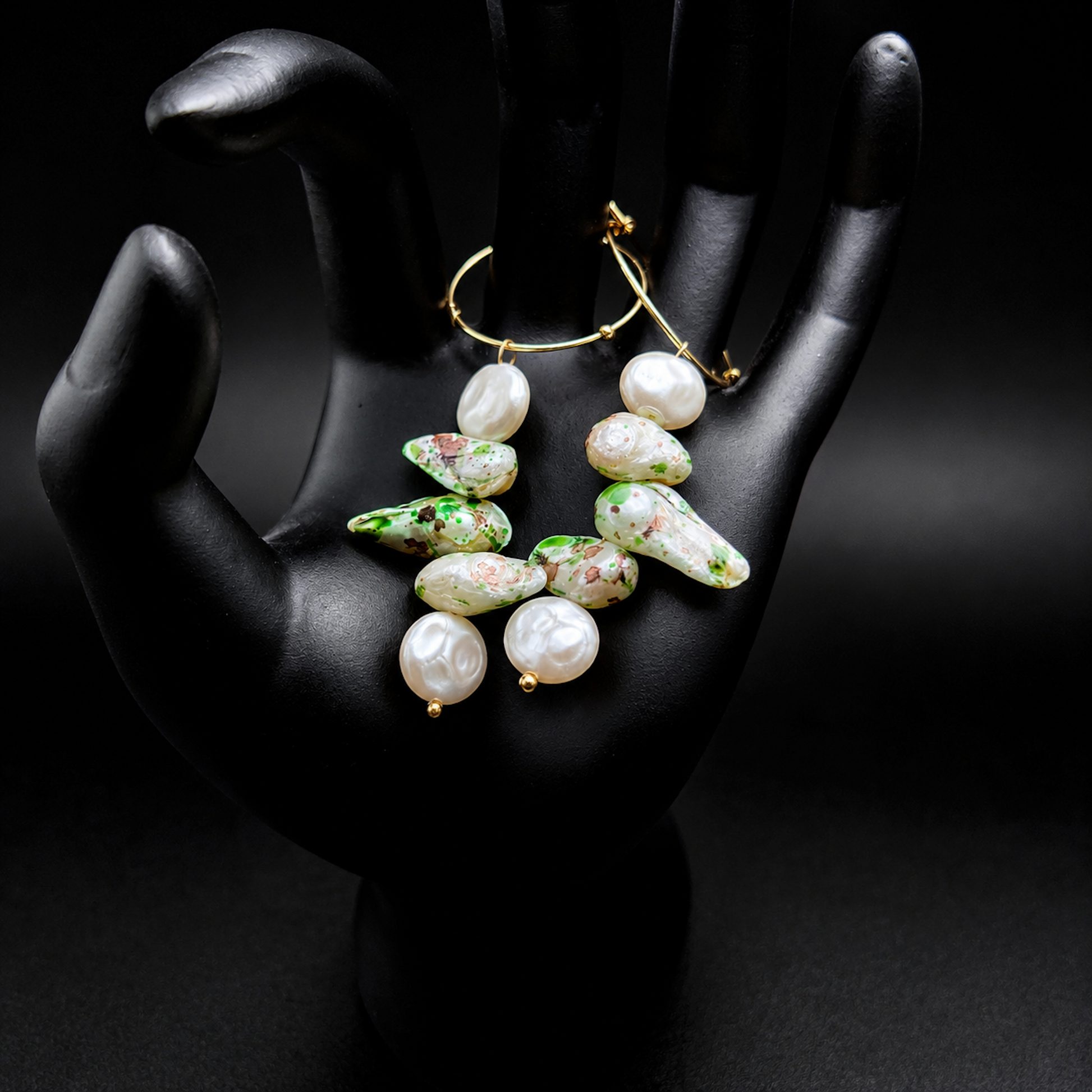 Gold hoop earrings with irregular white baroque pearls and green marbled accents