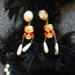 Victorian Gold-Toned Skull Dangle Earrings with Pearls and Red Gemstone Eyes